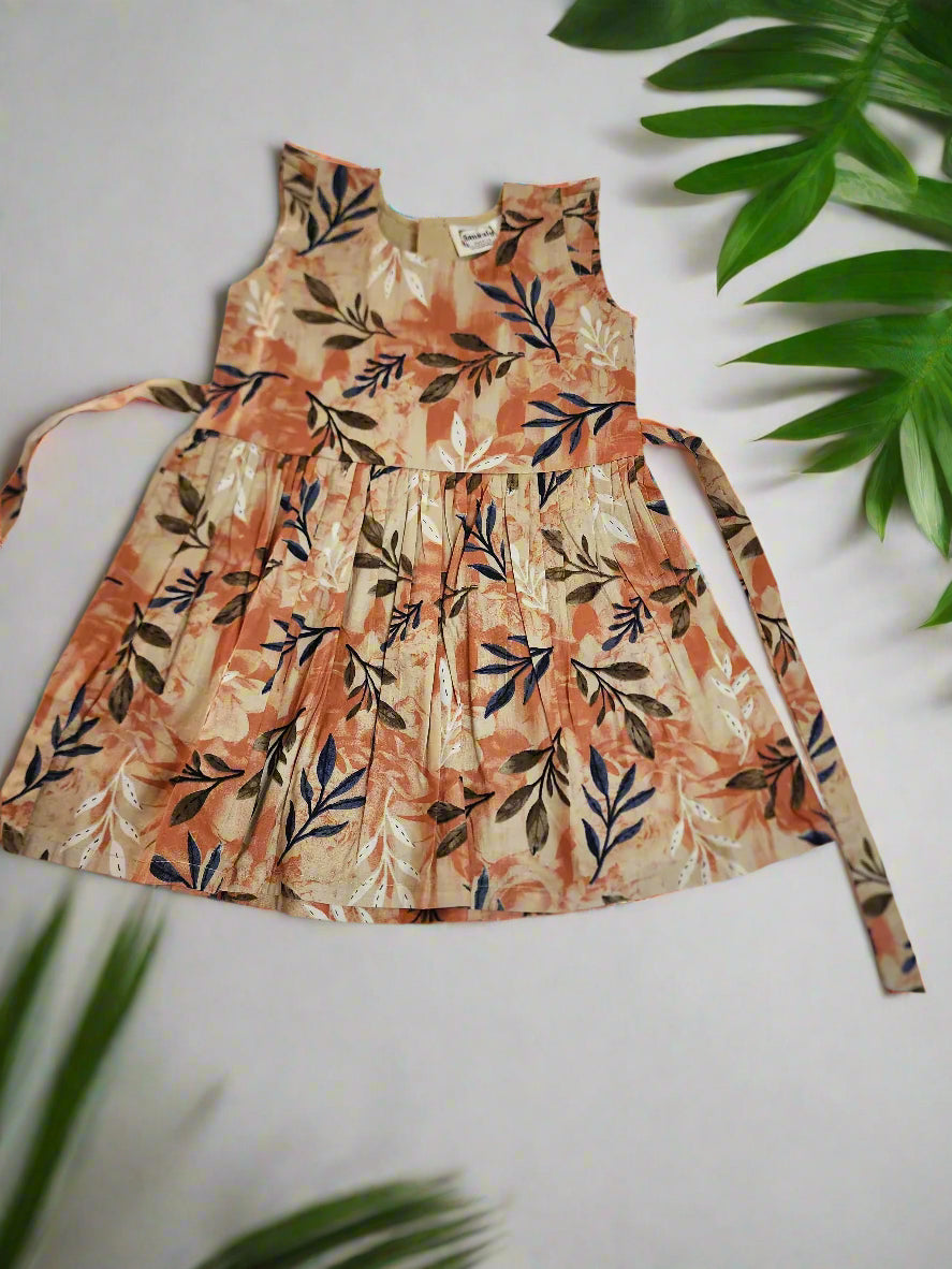 Floral dress on a white background with green leaves