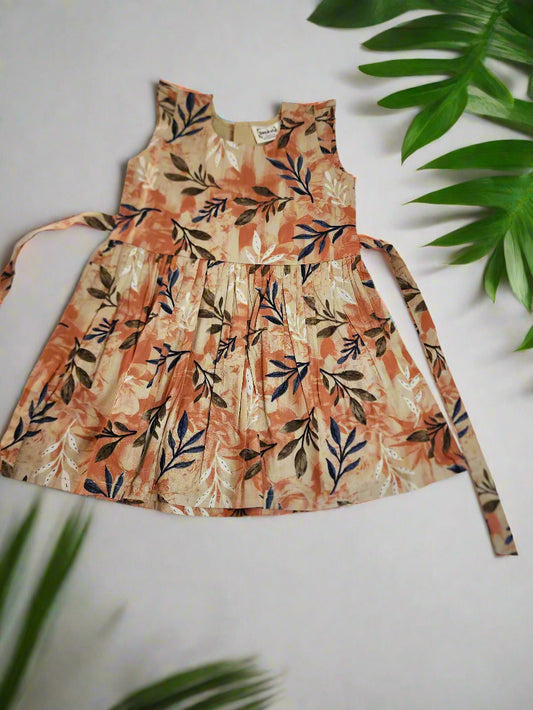Floral dress on a white background with green leaves