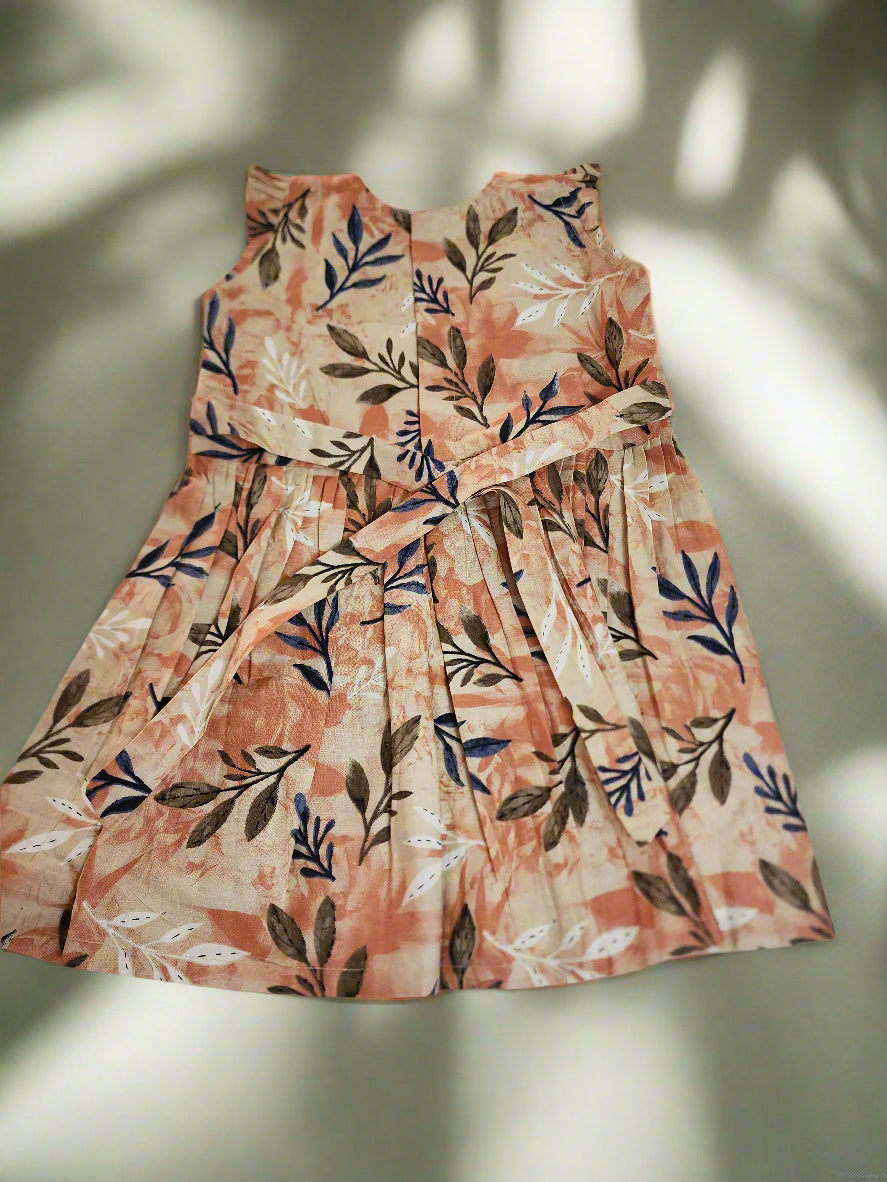 Floral dress with a leaf pattern on a light background
