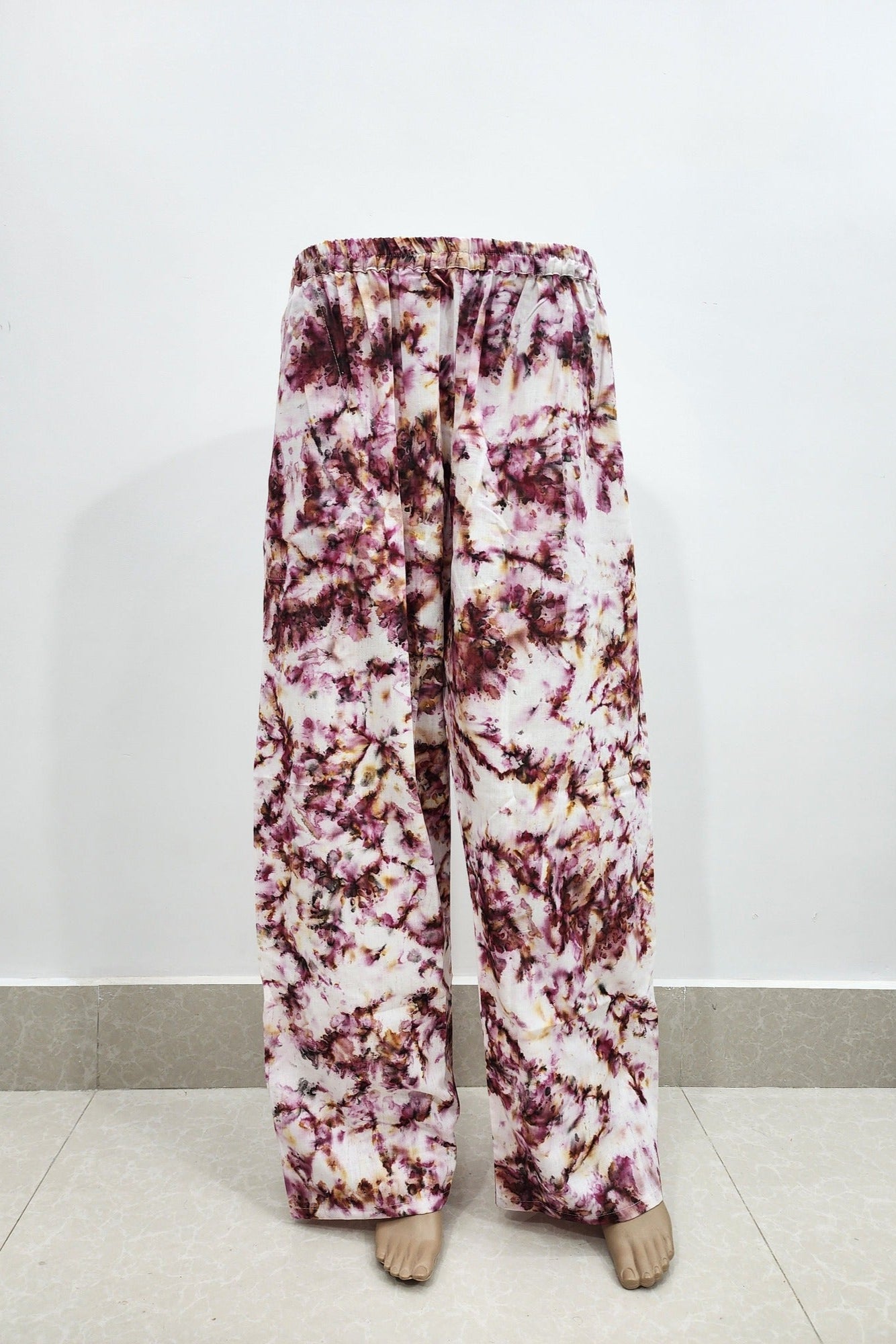 Floral patterned pants on a white background