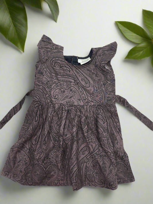 Brown patterned dress on a white background
