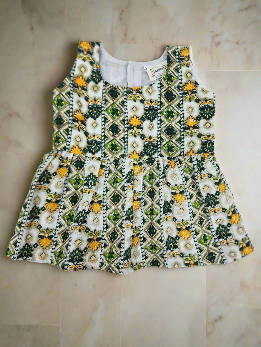 Embroidered top with floral and geometric pattern on a white background