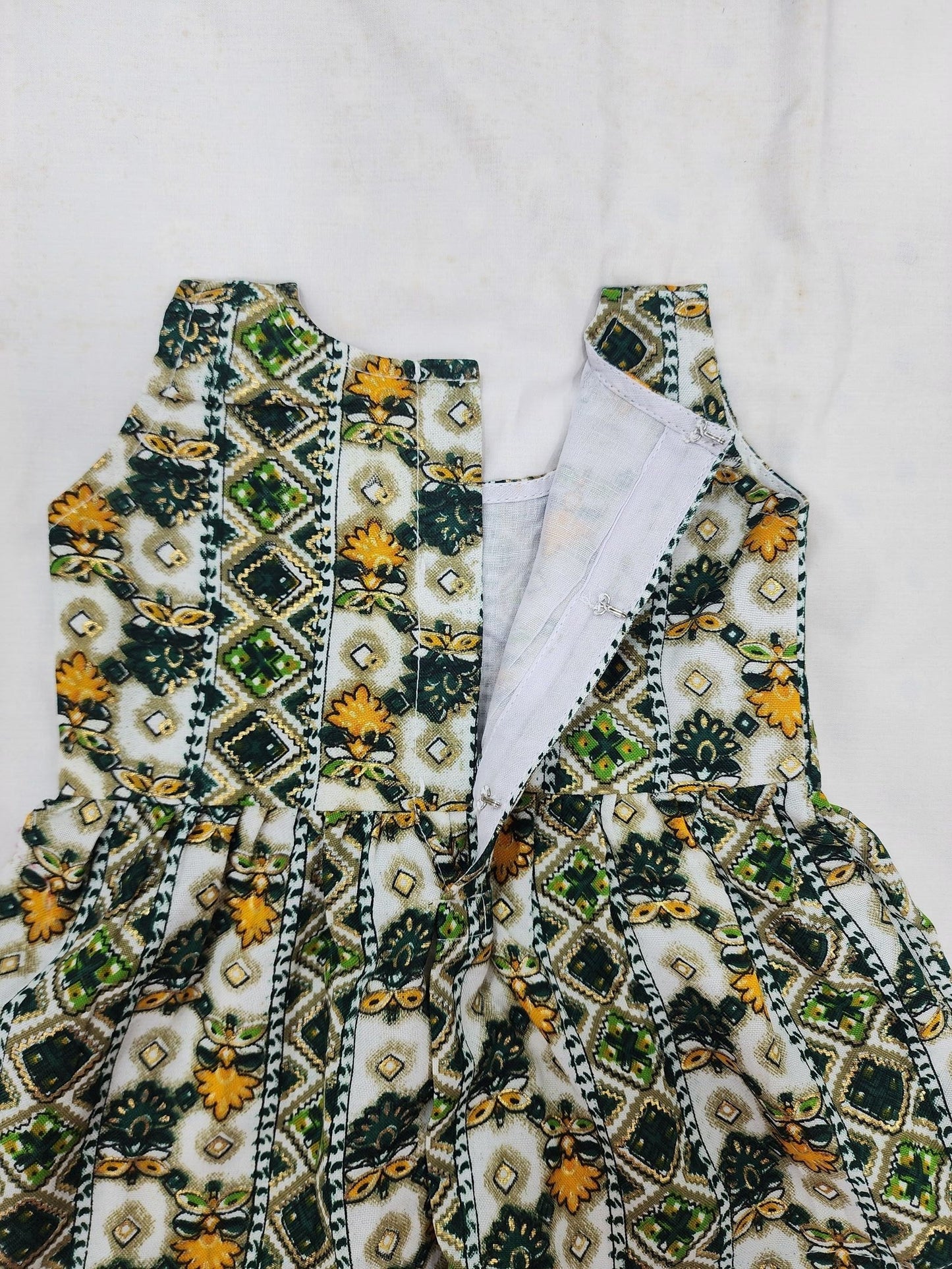 Embroidered garment with intricate patterns on a white background