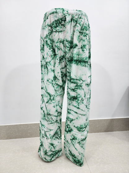 Green and white patterned pants on a white background