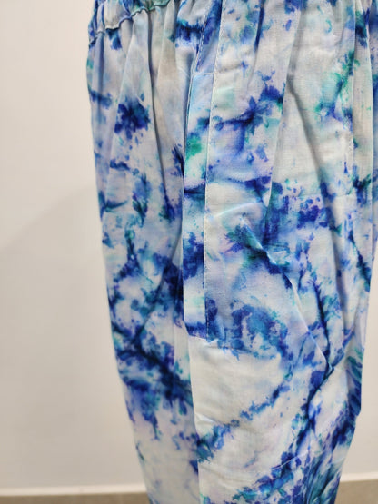 Blue and white tie-dye pants on a white background