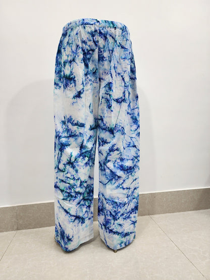 Blue and white tie-dye pants on a plain background