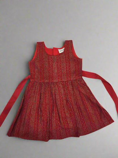 Red dress with pattern on a gray background