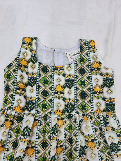 Decorative top with green and yellow patterns on a white background