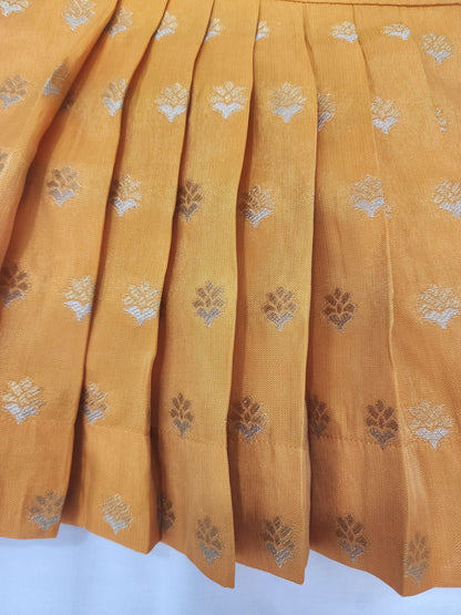 Mustard yellow fabric with floral patterns on a white background