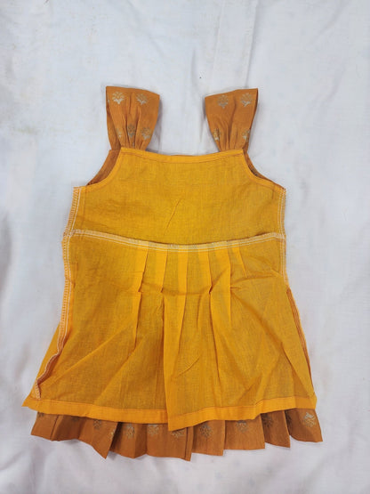 Yellow dress with ruffled hem on a white background