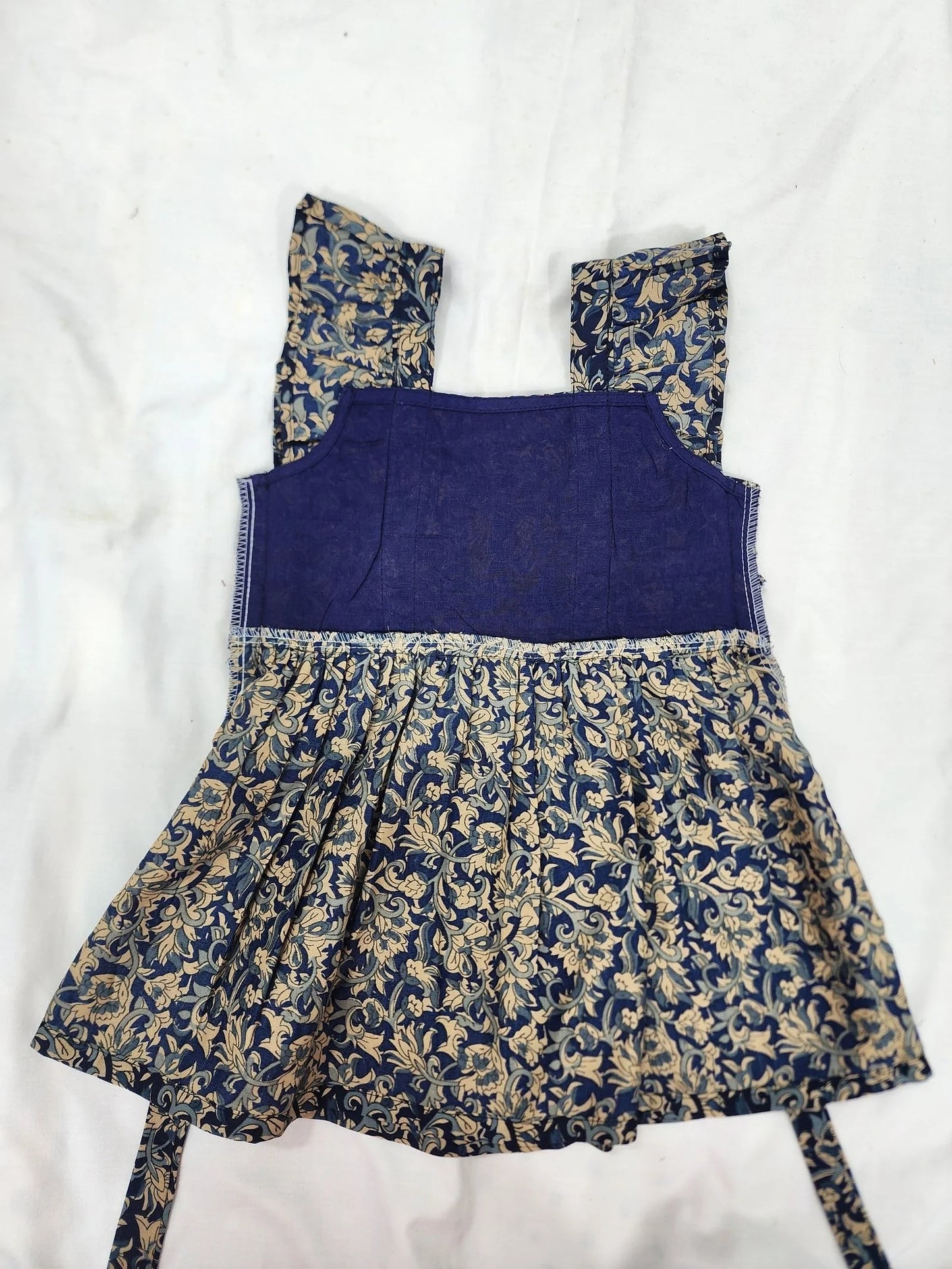 Blue dress with floral patterns on a white background