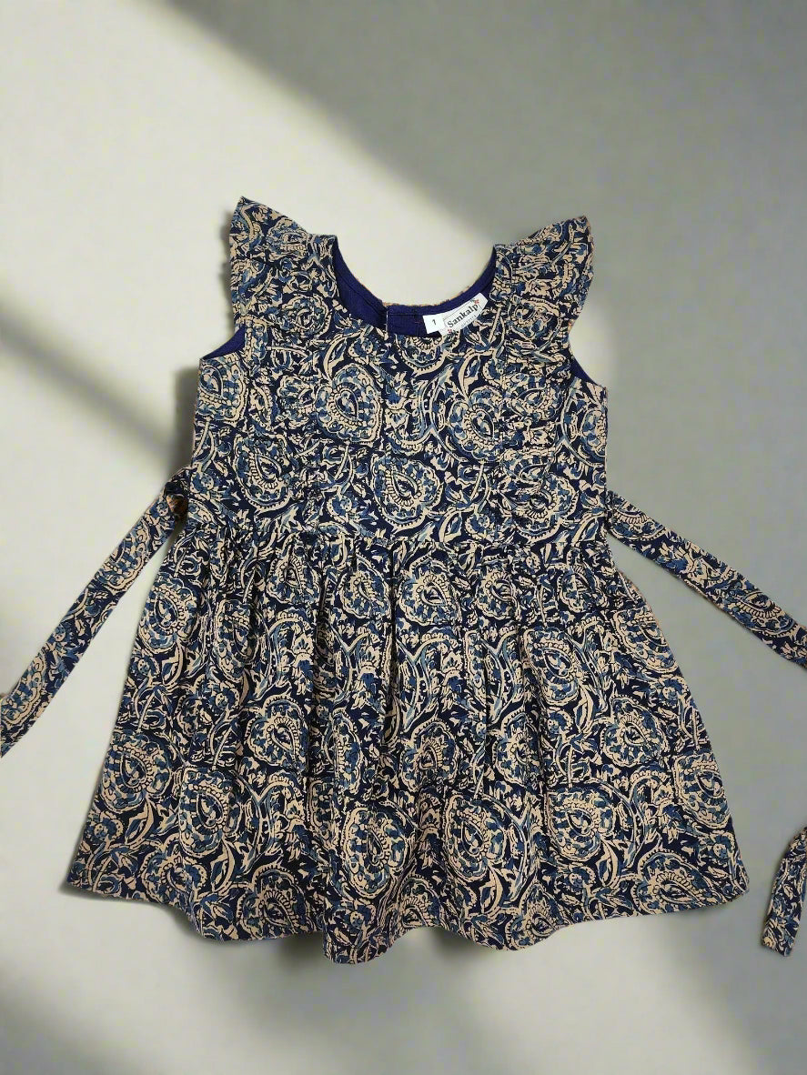 Blue and gold patterned dress on a white background