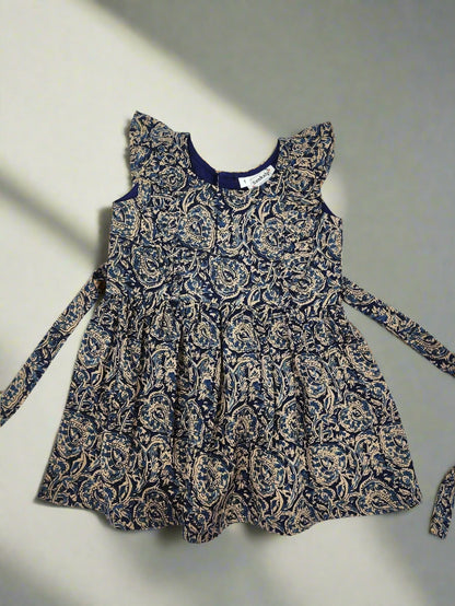 Blue and gold patterned dress on a white background