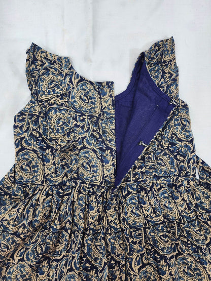 Blue and gold patterned garment on a white background