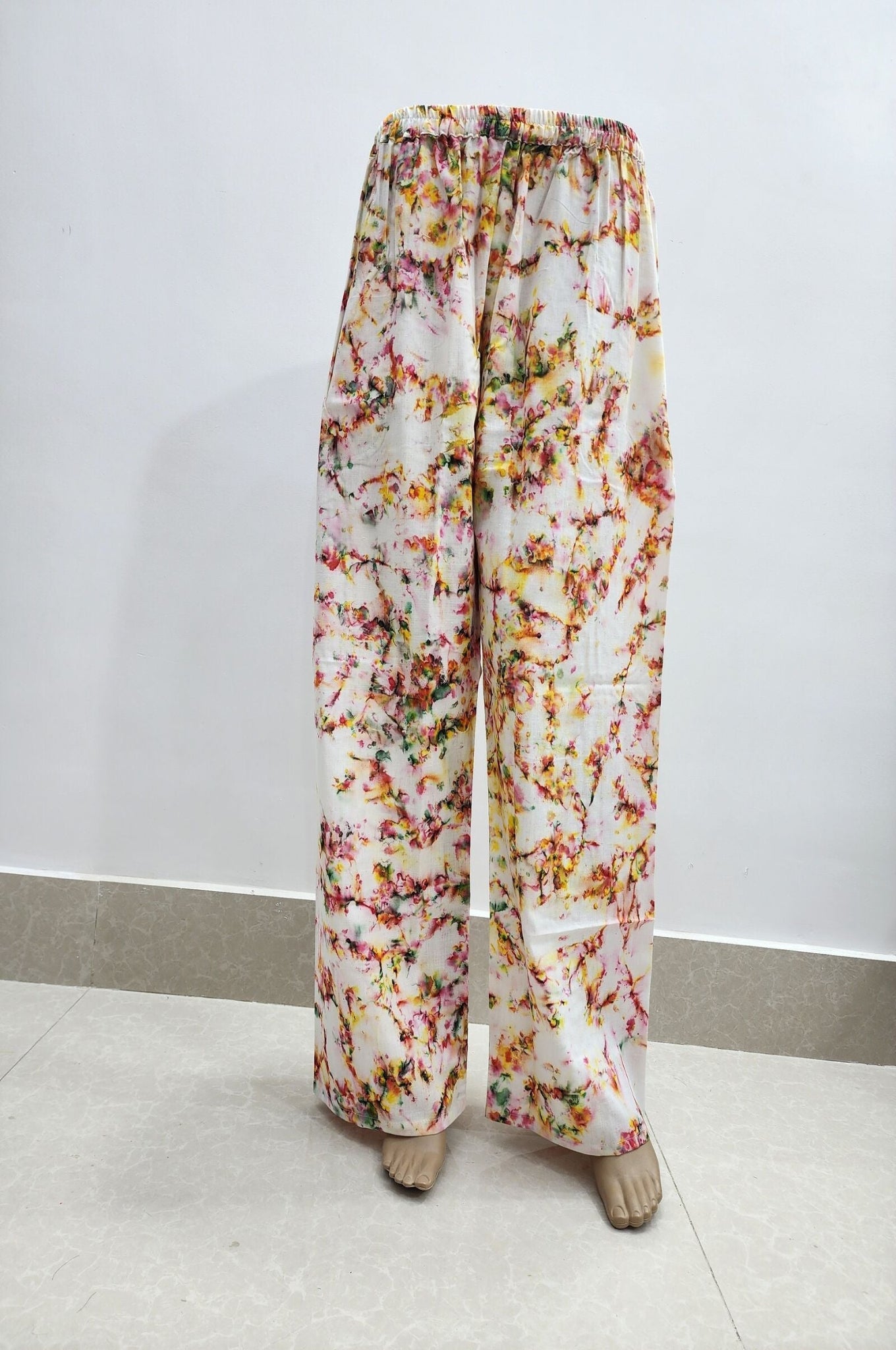 Floral-patterned pants on a white background